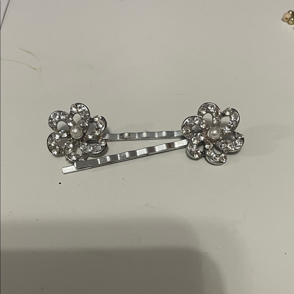 Silver bobby pins with floral rhinestone accent